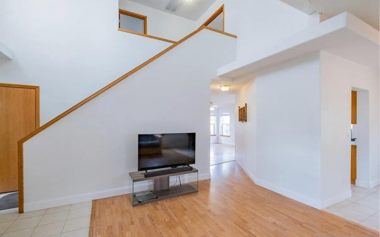 Entryway before redesign, with plain staircase